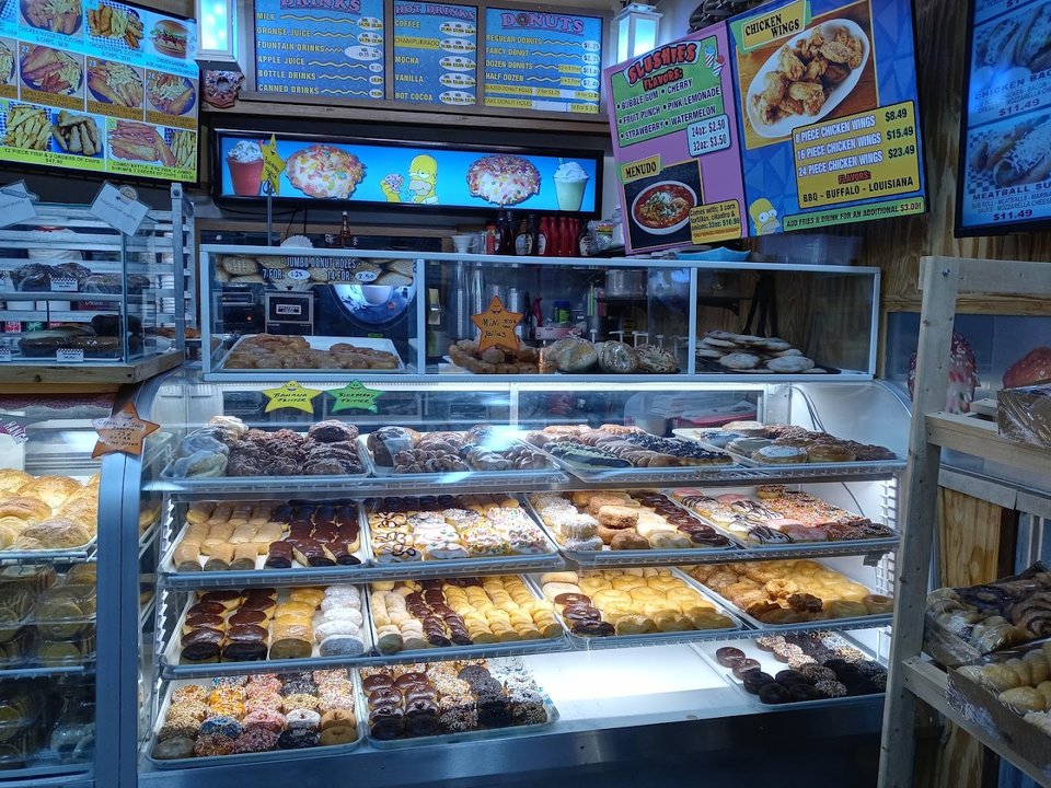 Pizza slices on a counter display.