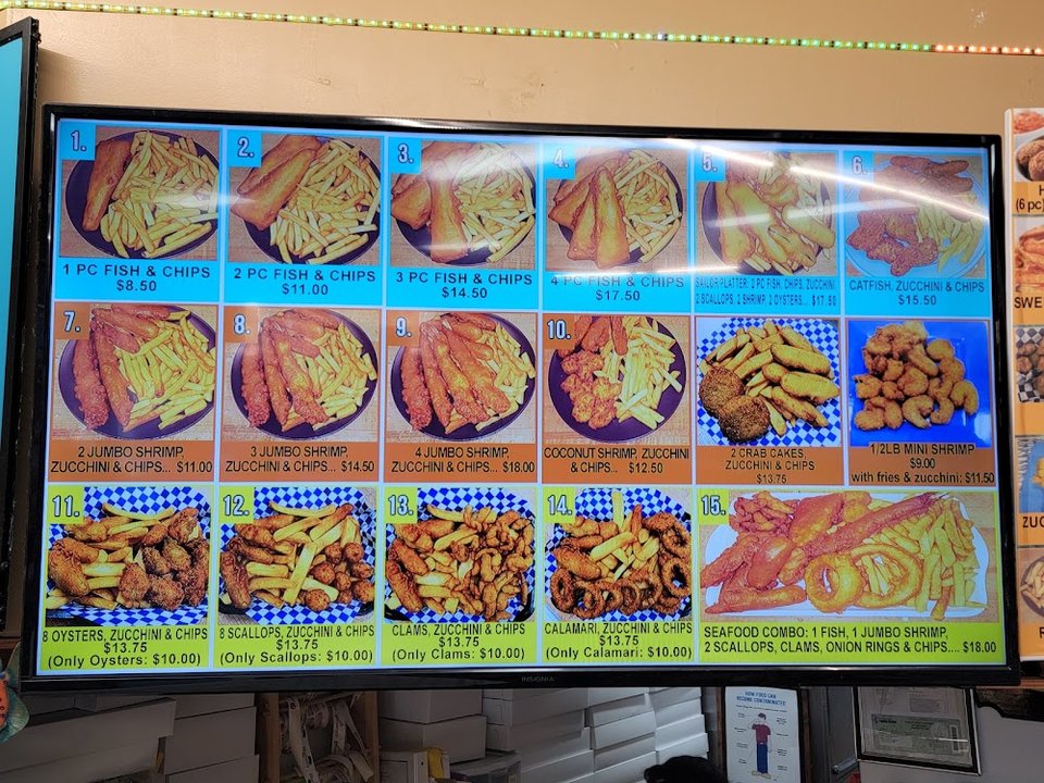 Food menu with fish and chips options.