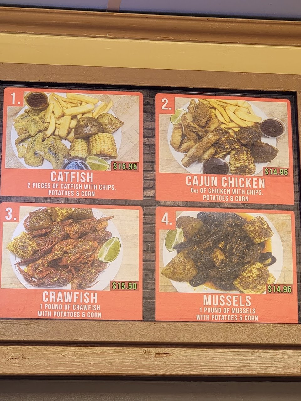 Printed menu with fish, burgers, and pizza.